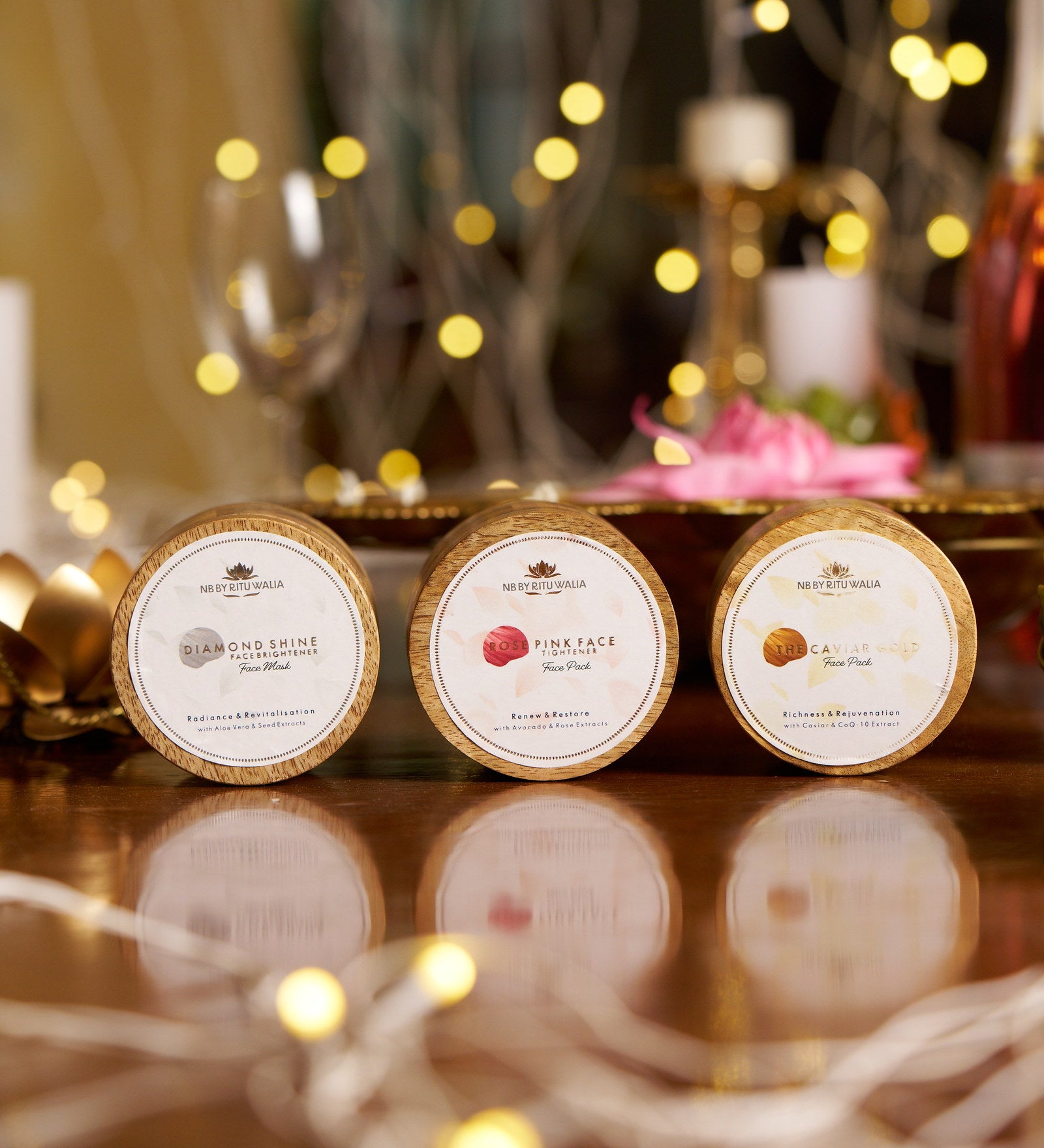 The Complete Ritual Set — Diamond Shine, Rose Pink and Caviar Gold face packs by NB by Ritu Walia, lids engraved and lit by candlelight