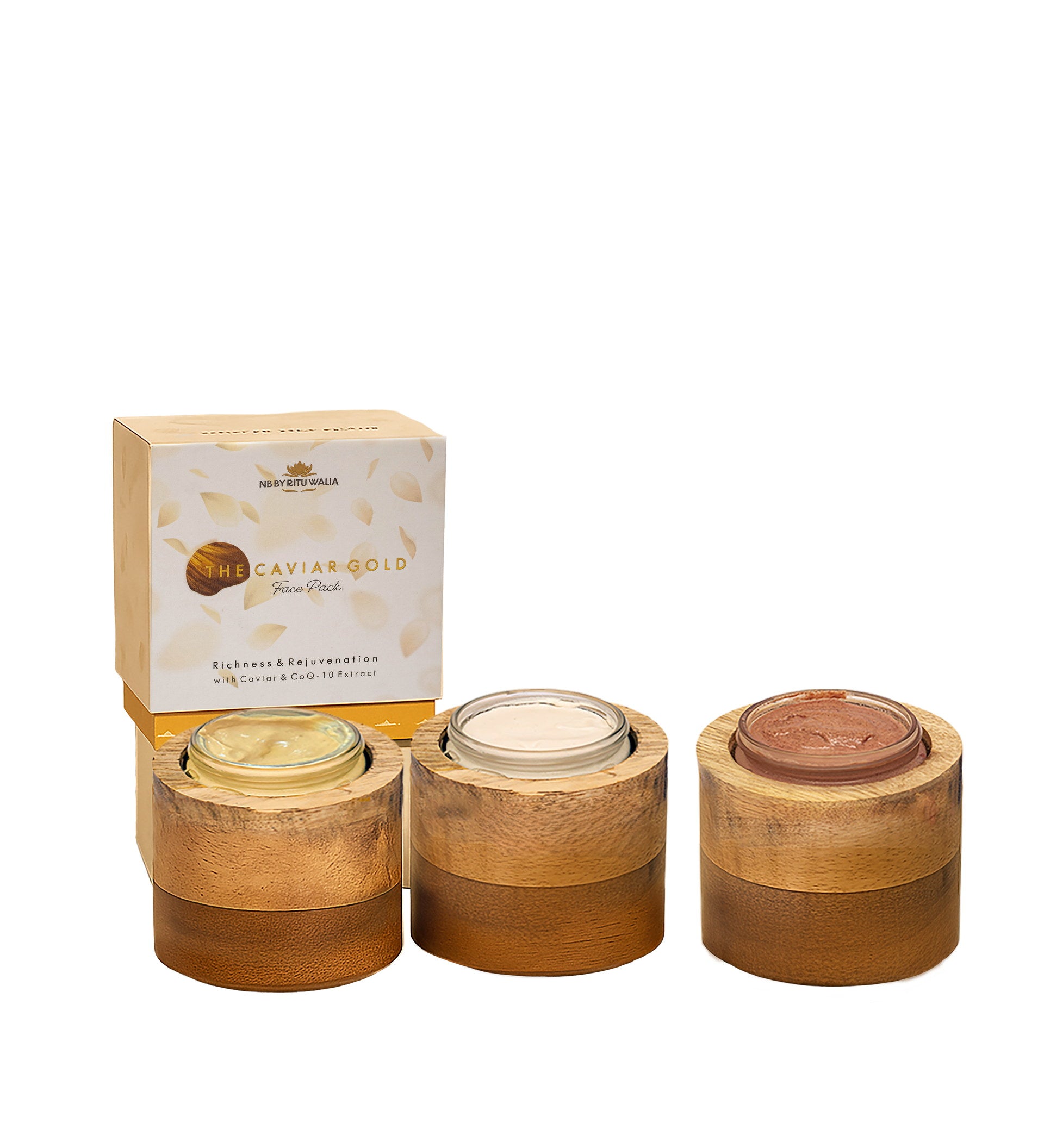 All three NB face packs open in their mango-wood vessels — Caviar Gold, Diamond Shine and Rose Pink textures side by side