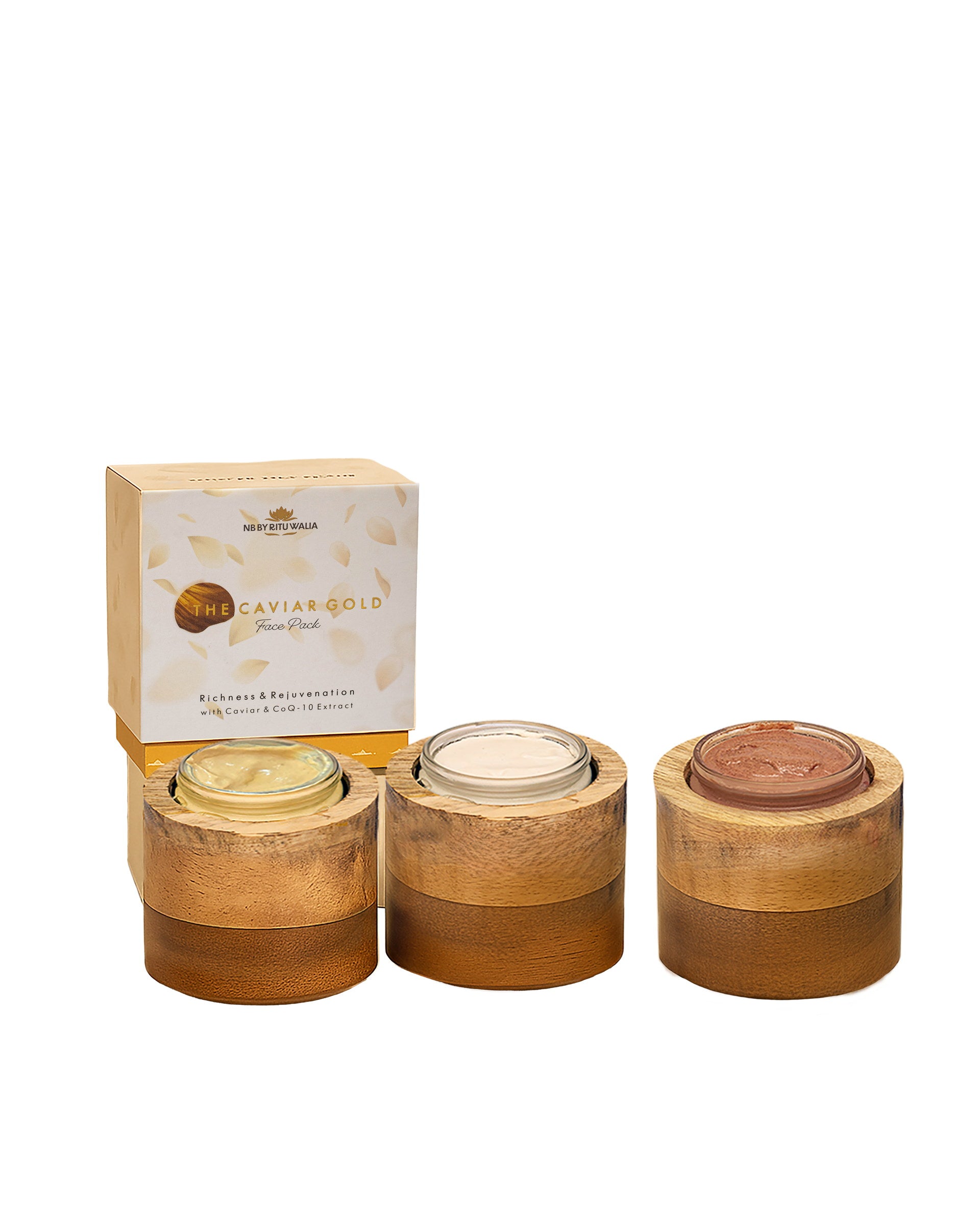 All three NB face packs open in their mango-wood vessels — Caviar Gold, Diamond Shine and Rose Pink textures side by side
