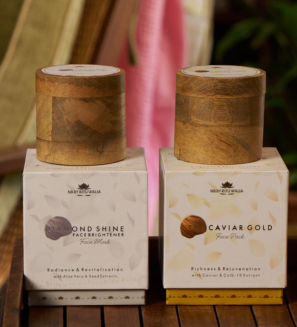Diamond & Caviar Set — Diamond Shine Face Brightener and The Caviar Gold Face Pack in their boxes, mango-wood jars above