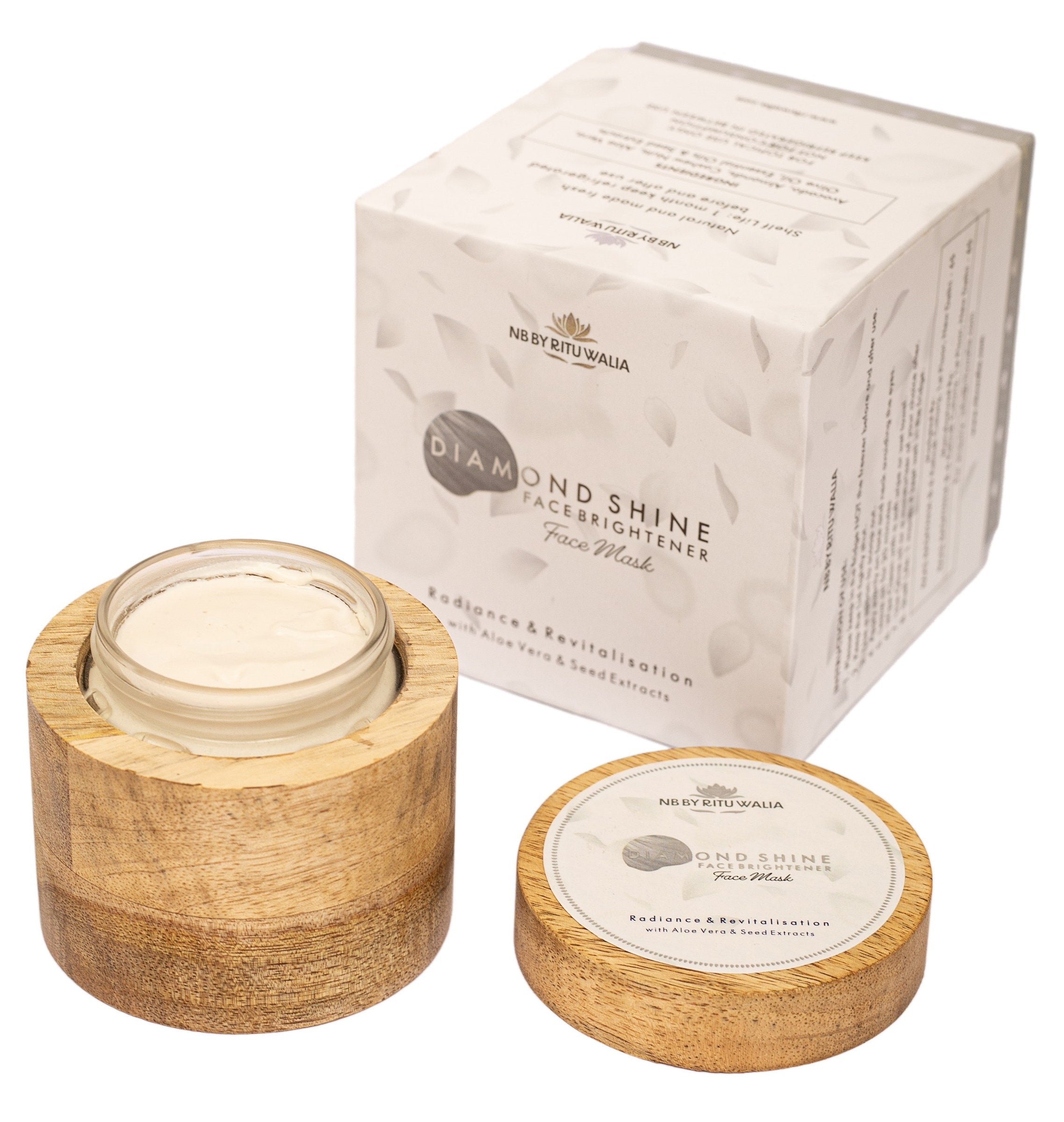 Diamond Shine Face Brightener open in its mango-wood vessel beside its box, showing the pearl-white texture