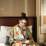 The ritual observed in a hotel suite — silk robe, silver tray and a mask worn at leisure